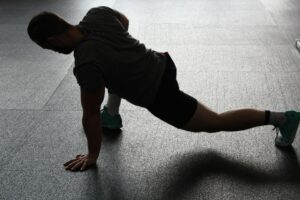 Hip flexor stretching reduces anterior pelvic tilt and supports lumbar curve correction.